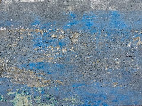 Gritty urban texture presenting a compelling visual narrative of fading blue and stark gray elements
