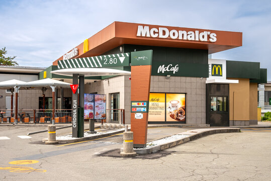 Fossano, Italy &ndash; May 19, 2026: McDonald's restaurant with McDrive and McCaf&eacute; service station, Modern exterior design with view of the drive-through lane for ordering and pickup