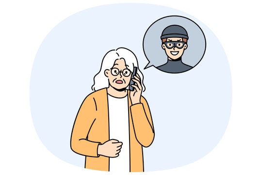 Elderly woman talking to telephone scammer who is trying to find out bank account password. Telephone scammer calls grandma, intimidating and forcing to provide personal information or using blackmail