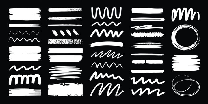 Set of white hand drawn brush strokes and lines on black background, design elements
