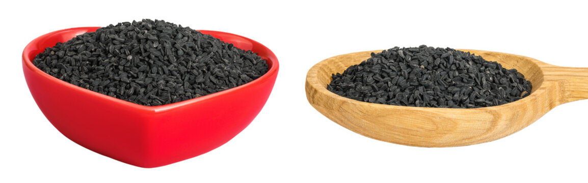 Nigella sativa or Black cumin in ceramic bowl and wooden spoon isolated on white background