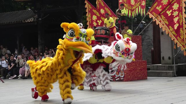 Traditional Chinese Lion Dance Performance with Drummers and Audience