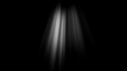 Abstract light rays shining down from above on a black background with a grainy texture effect © Studio Fiuza