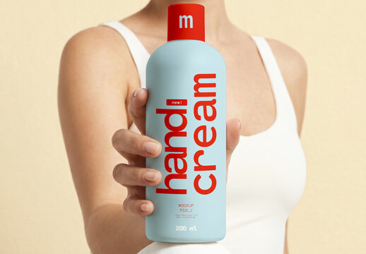 Hand Cream Bottle Mockup Held by Model