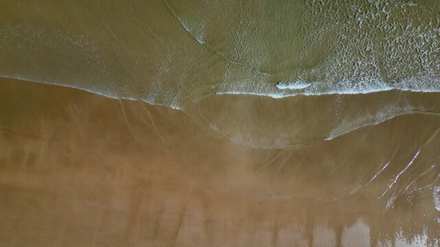 Aerial Top-Down View of Ocean Waves on Rodiles Beach in Asturias, Spain
