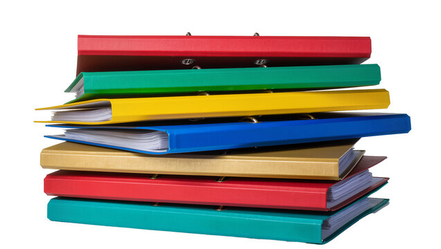 Stack of colorful ring binders with paper inside