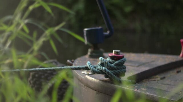 Boat tied with a rope on moorings 