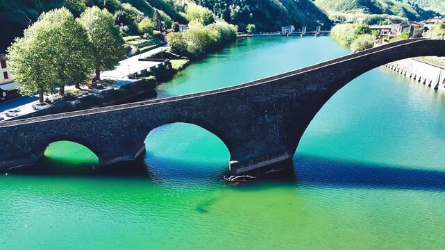 Aerial view of Devil's Bridge Ponte della Maddalena Borgo a Mozzano over Serchio River Tuscany Italy