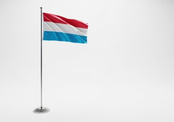 Fototapeta premium Luxembourg flag waving on a flagpole isolated on white background