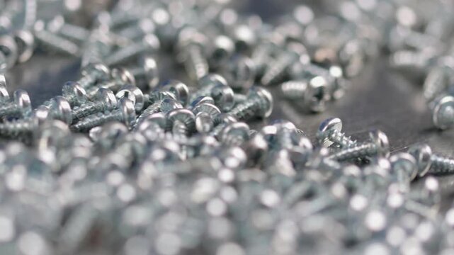 Metal screws for fastening equipment. Soft focus. Close-up. 