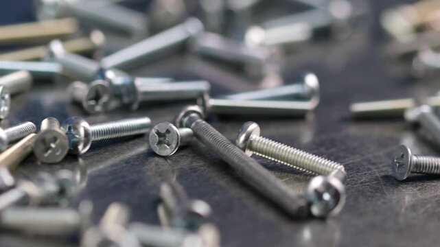 Metal screws for fastening equipment. Soft focus. Close-up. 