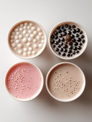 Obraz premium Overhead view of Taiwanese bubble milk tea with tapioca pearls set against a pastel minimalistic background.