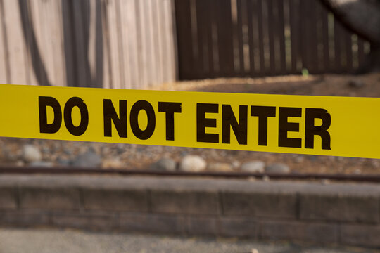 Do Not Enter Tape Marking Restricted Access Zone warning about prohibited access and securing a closed area from unauthorized entry