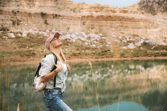 Female Backpacker Exploring Mountain Landscape