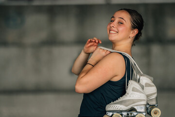 Obraz premium figure skating athlete with skates smiling outdoors