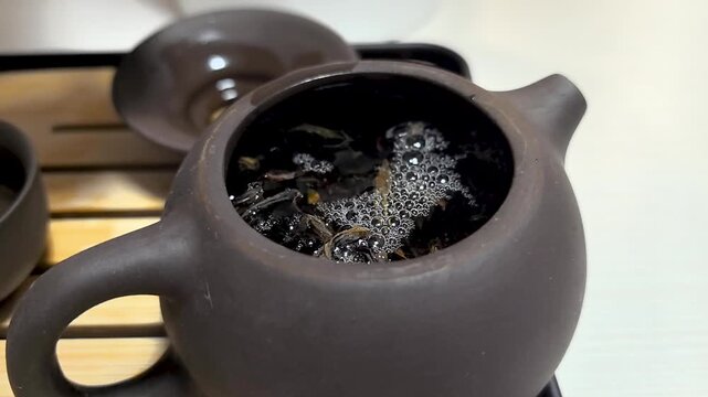 Experience the art of a traditional tea ceremony in a serene setting. Witness the careful brewing process as the tea leaves dance in boiling water, bringing forth rich aromas and flavors.
