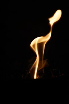 burning match on black background