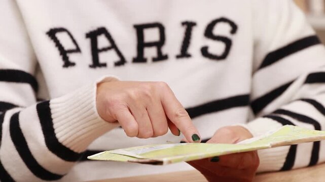 hand checking the map and destination of the trip