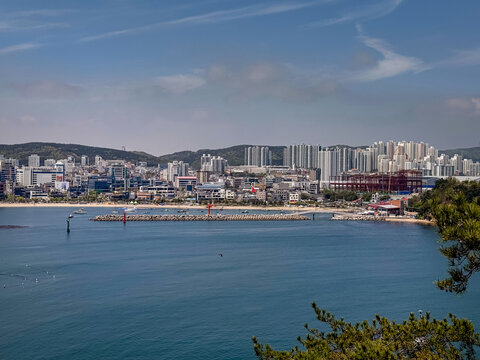 Ulsan, South Korea, April 18, 2026: Ilsan Beach View with Apartments, Village, Houses, Homes, Mountain Cityscape 울산 일산 해수욕장 도시 전경

