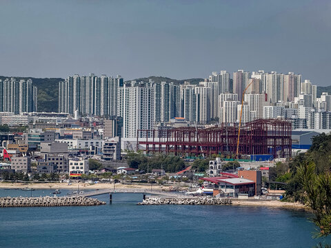 Ulsan, South Korea, April 18, 2026: Ilsan Beach View with Apartments, Village, Houses, Homes, Mountain Cityscape 울산 일산 해수욕장 도시 전경
