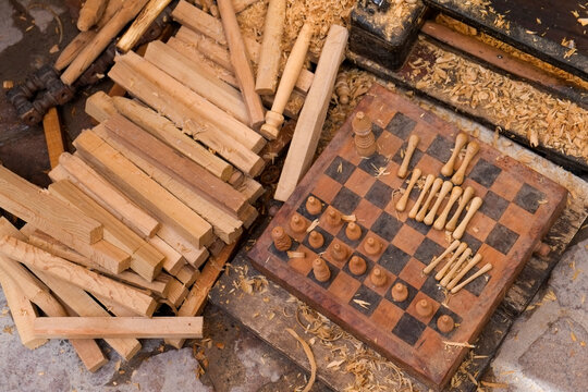 Wooden board games and carved game pieces