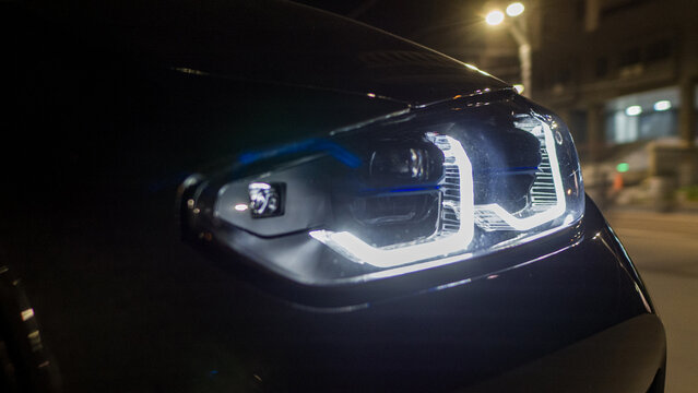 Car headlight glowing at night with led technology