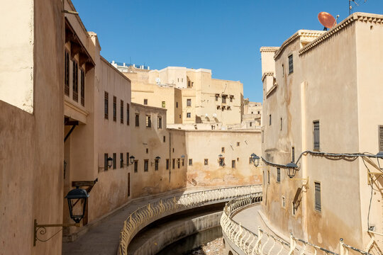 Narrow medina street with warm adobe walls