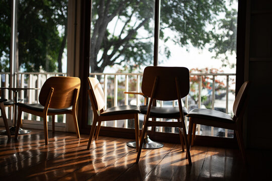 Cozy Coffee Shop with Wooden Chairs and Natural Light