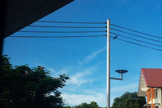 Clear Sky Over Power Line and Modern House