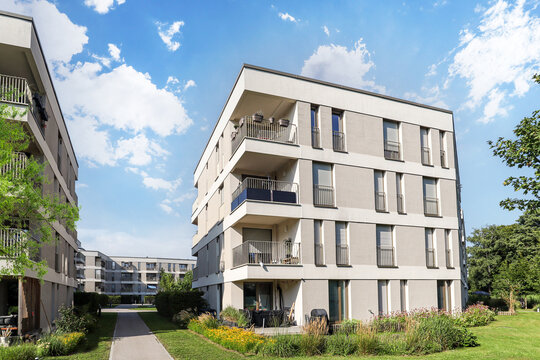 Cityscape of a residential area with modern apartment buildings, new sustainable development and green urban landscape in the city, concept for construction industry and real estate