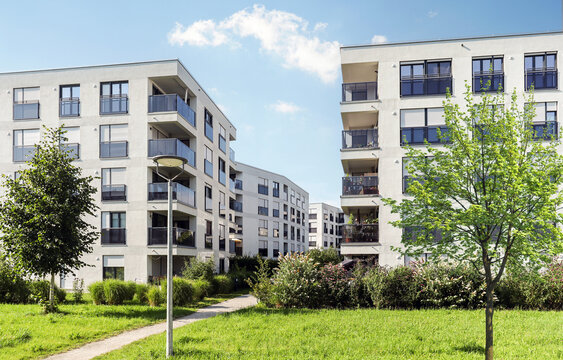 Cityscape of a residential area with modern apartment buildings, new sustainable development and green urban landscape in the city, concept for construction industry and real estate