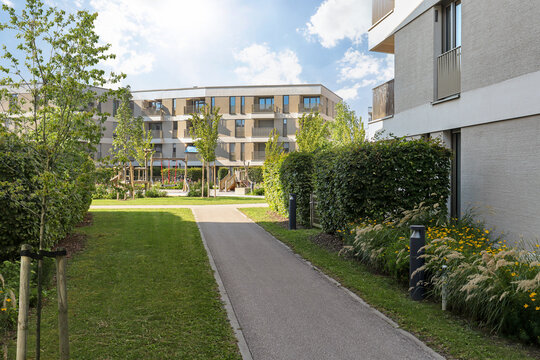Cityscape of a residential area with modern apartment buildings, new sustainable development and green urban landscape in the city, concept for construction industry and real estate