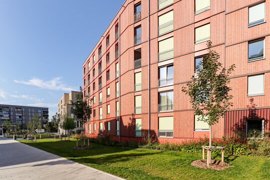 Cityscape of a residential area with modern apartment buildings, new sustainable development and green urban landscape in the city, concept for construction industry and real estate