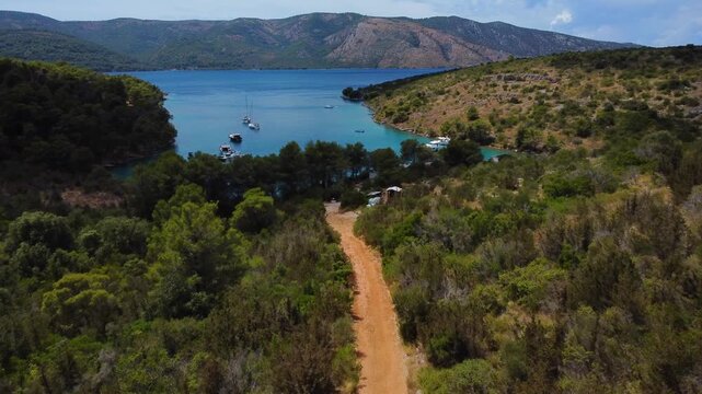Drone flying towards zavala cove on hvar island in croatia