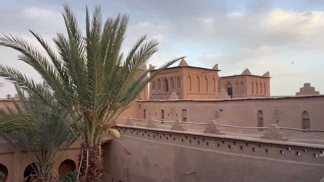 Ancient Kasbah Amridil fortress at dusk with traditional Moroccan mudbrick architecture