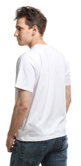 Fototapeta premium Handsome young man wearing blank t-shirt on white background. Mockup for design