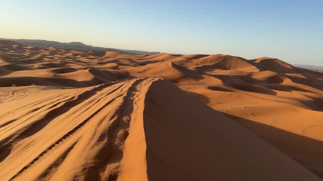 Golden sunrise over Sahara sand dunes near Merzouga, Morocco desert