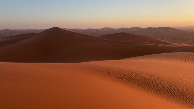 Golden sunrise over Sahara sand dunes near Merzouga, Morocco desert