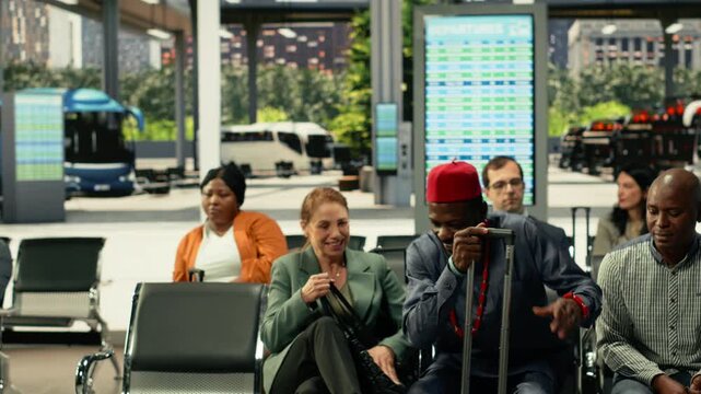 Accidental collision between travelers crossing paths in busy bus station hall. Crowded public transport terminal with people carrying bags, rushing toward departure platforms during rush hour.