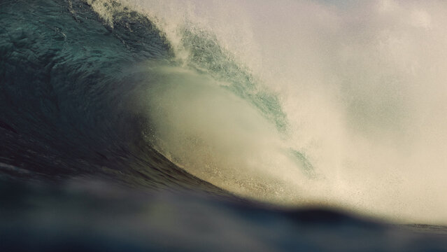 large tubular wave breaking in the morning light