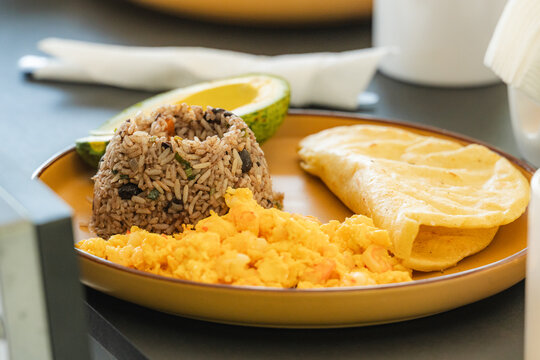 Gallo pinto breakfast with scrambled eggs and avocado