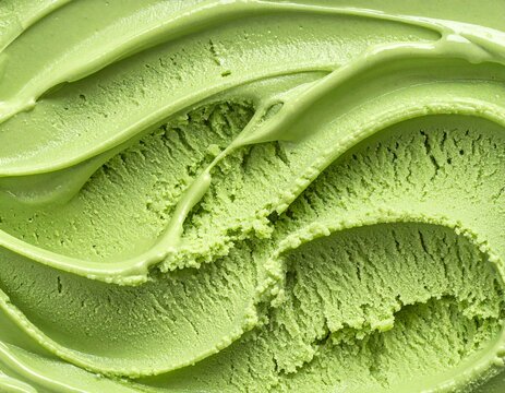 Macro top view texture of green tea matcha ice cream with scoop marks and horizontal ridges