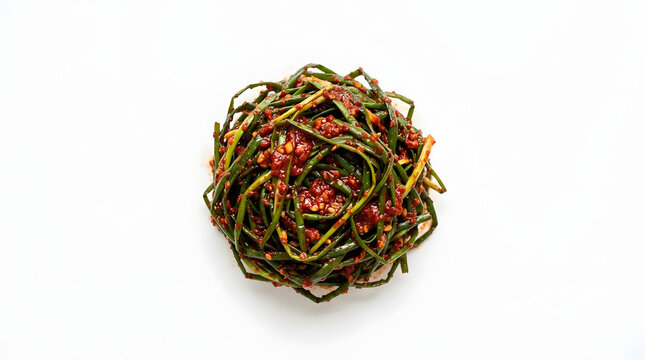 Vibrant Korean buchu garlic chive kimchi marinated in spicy red fermented chili paste, isolated on a solid white background