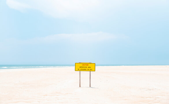 beach caution sign no lifeguard outer banks north carolina