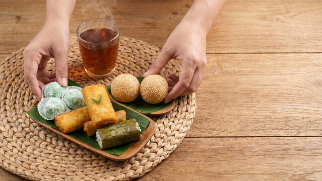 Serving Traditional Indonesian Jajanan Pasar Assorted Snacks on Rattan Mat
