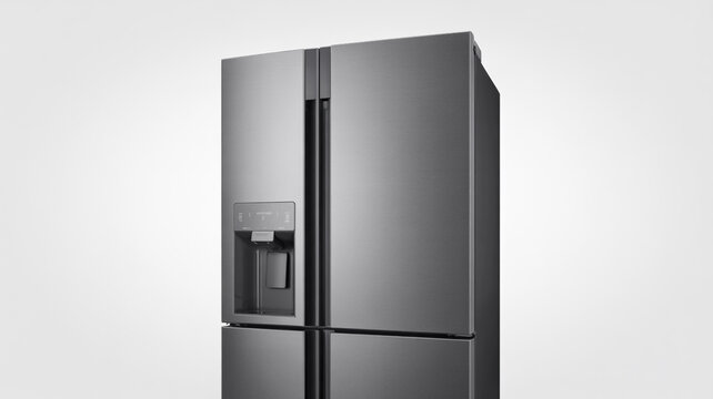 Modern stainless steel refrigerator with water dispenser on a light background