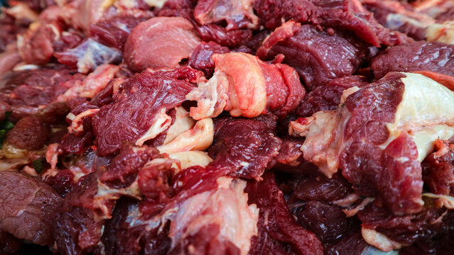 Raw chopped beef meat pieces with fat high protein food ingredient close up