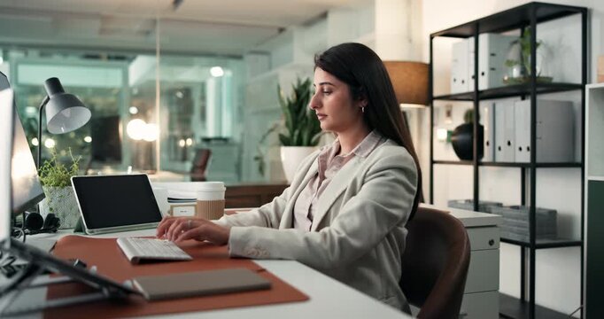 Business, typing and woman with computer, night and copywriting with internet, tech and email. Evening, person and journalist in office, pc and editing with deadline for news report or creativity
