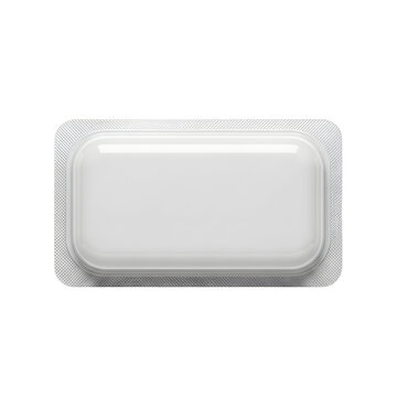 Single white medical pill in silver blister pack on gray background