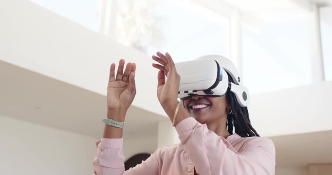 African American adult donning white VR headset tapping virtual items exploring home with mint band